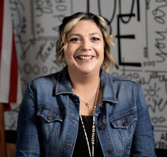 A teacher smiling