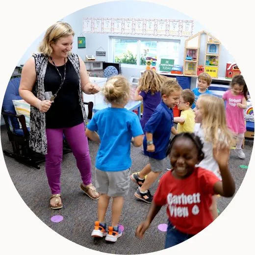 A teacher and young students in a classroom in Tampa, Florida